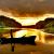 Woman in boot by sunset von