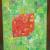 Red dice on green background von FH